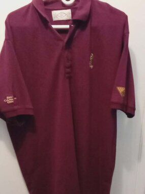maroon polo shirt  for an event  Bell Canadian Open  golf tournament